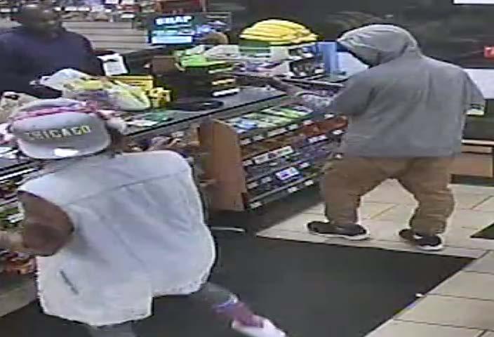 the store clerk The suspect with two hands on