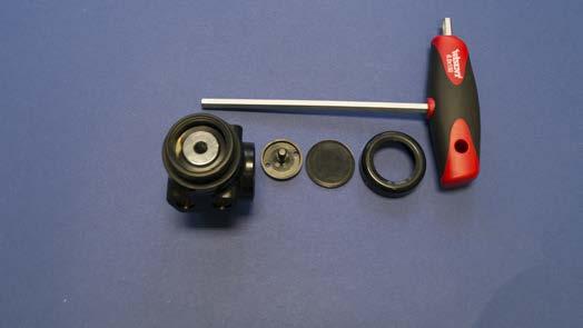 Use O-ring pick tool to separate and discard the O-rings from the balance plug. Set the balance plug aside for cleaning.