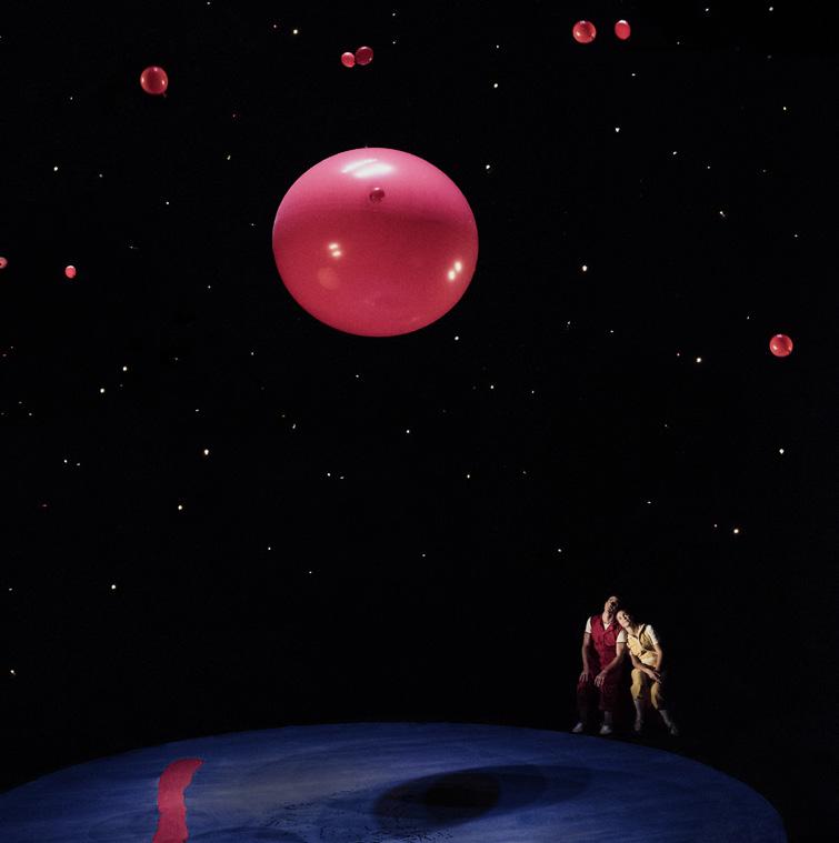 The giant red balloon flies up into the air.