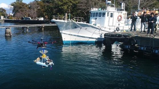 Fig. 9: Multicopter delivers USV from the pier to the sea. Fig. 10: ROV launched from USV. Fig. 11: Underwater image taken by the ROV (pier s underwater structure). 5.