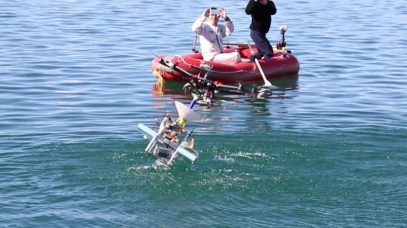 releases or winds up the cable in accordance with the motion of the ROV. The docking device between the multi-copter and the USV is also developed.