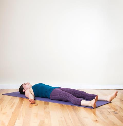 Lift your hips up, and place your hands on either side of your lower back. Rock your weight from side to side, so you can pull your shoulder blades closer together.