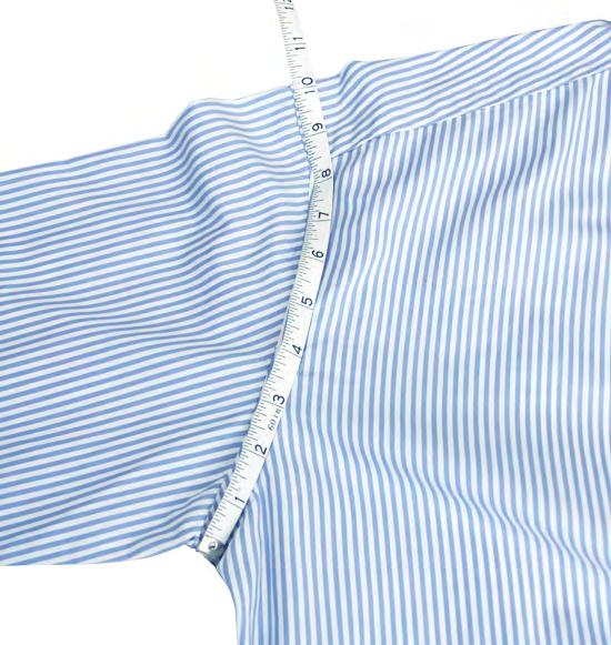 HALF ARMHOLE Place the shirt on a large flat surface so the front of the shirt is facing you.