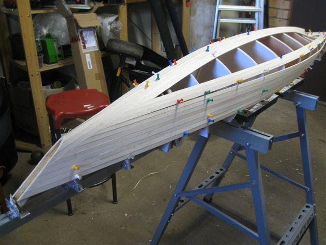 Gunboat starting to take shape Planking was then started at the gunwale, 8 planks each side of the hull took the planking to the location of the beginning of the tumble home.
