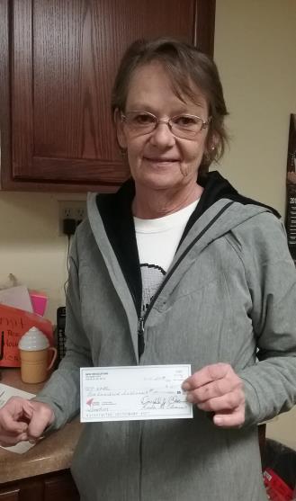 Saturday November 10, 2018 North-East Washington Regulators Donates to the Colville Food Bank Rhinda Wolfe of the Colville Food Bank holding check for donation of $200.