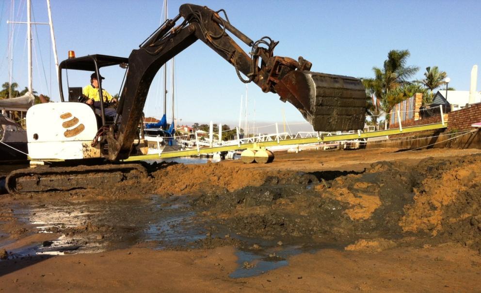 Working here at Raby Bay for Redlands Shire Council to correct silt build up as a result of a stormwater outlet in a marina.