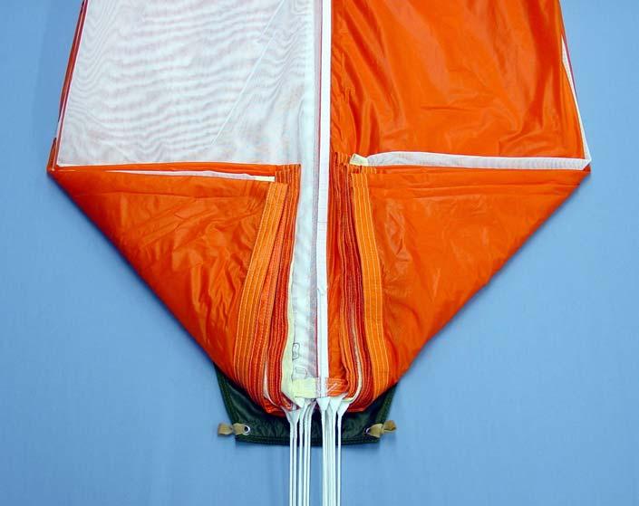 Fig 8 Folding the canopy : stage 2 8.2 Fold over the diaper closure flap and ensure that the grouped rigging lines are lifted over the flap and not trapped underneath the flap.