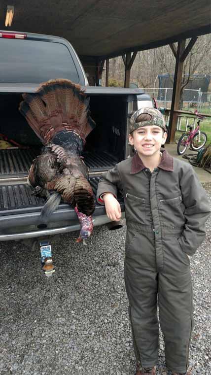 HIWASSEE / OCOEE RIVERS Trey Andrews, age 11, with his big bird - 22 lbs, 11 b., 11/4 s. Photo Benton Shooters Supply.