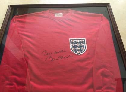 Lot 5. A signed, framed, Bobby Charlton 1966 World Cup Winner s shirt.