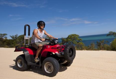 adventure takes you to the Tangalooma Desert to experience the famous sand tobogganing!