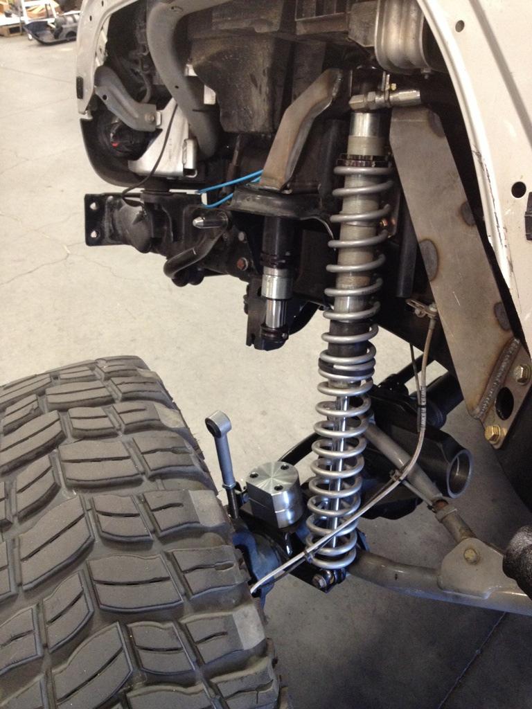 9. With all three coilover brackets in place. Tighten the center coilover mounting bracket 5/8 hardware. (photo 7) 10.