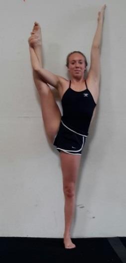 The opposite arm is extended to approximately the same angle as the leg. The body should have the shape of a Y. There may be a slight lean away from the lifted leg.