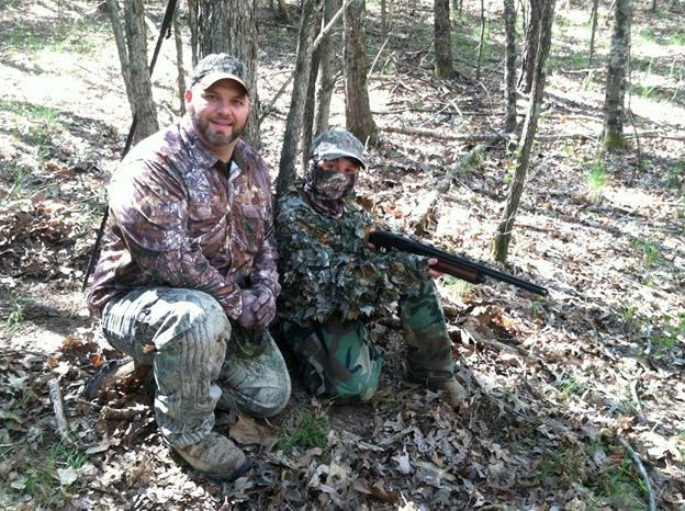 Chris and Landon Williams of Chickamauga, Georgia. Landon (right) is 11 years old and had a large gobbler sneak up behind him while DNR LED Sgt. Mike Barr was calling turkeys with a turkey box call.