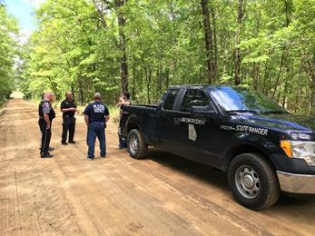 Later that day, Game Warden Mills was contacted to assist the Dodge County Sheriff s Office with searching for evidence in a double homicide case. Evidence pertaining to the case was located.