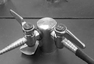 Bunsen Burner 1. Figures 1 and 2 show a Bunsen burner and a bench gas valve, respectively. Connect the rubber tubing from the gas inlet of the Bunsen burner to the outlet of the bench gas valve.