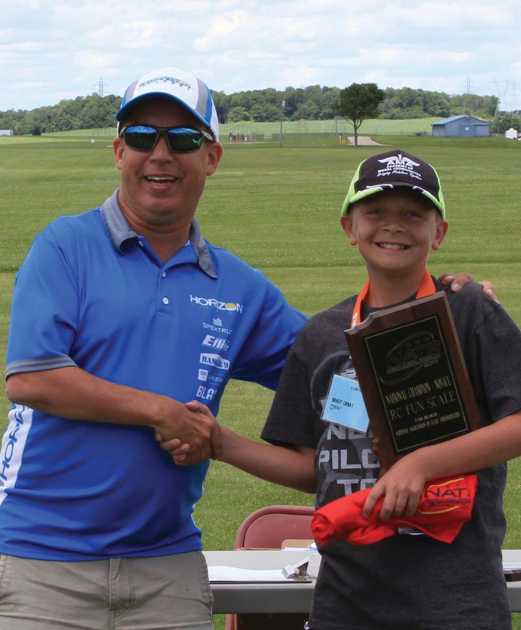 Event Director John Boyko presents Brady Ornat with the first-place trophy in Fun Scale Novice. Photo 2017 Nats.