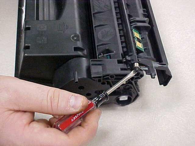 To separate the cartridge sections, first remove the OPC protective shutter by inserting a small