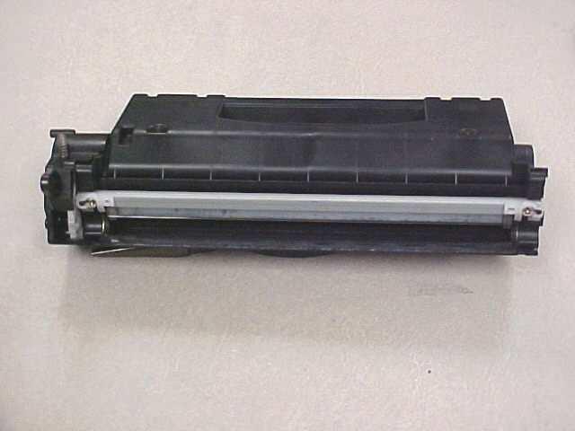 The developer roller drive gear, as well as the stabilizer on the other side of the cartridge, will remain in place after the removal of the developer roller.