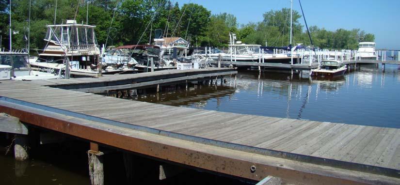 Jetties and breakwater serve to provide an open channel to the lake for vessels. 4. Four C s Marina: Privately owned marina with 45 fixed wooden seasonal slips able to accommodate boats up to 30'.