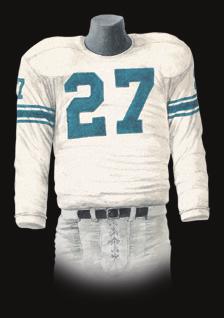 The jersey was scarlet with white numbers and the pants were white with a thin black stripe between two thin scarlet stripes. The helmets were black.