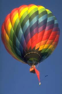 Hot air balloon The ideal gas law tells is that when a gas is heated, its density goes down so the air density inside