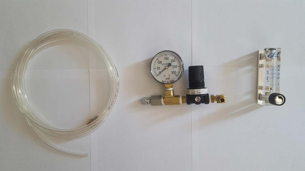 A close up look at the parts in the bag Tank pressure gauge Flow