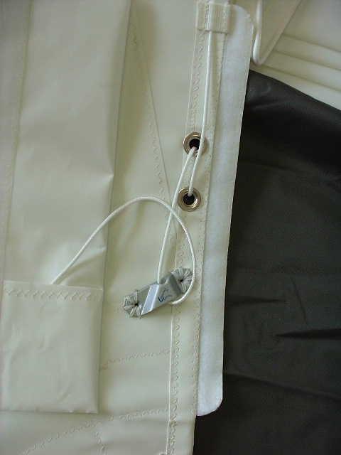 The following photo shows the leechline pocket opened to reveal the leechline, snubbing eyes, cleat and the tail pocket.