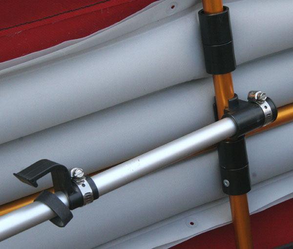 Note: When the longitudinal rods are installed, the stems are pushed into the ends of the canoe skin.