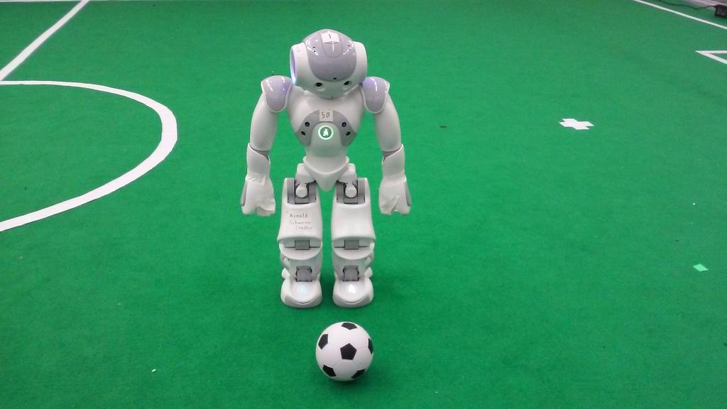Figure 5: A NAO and the official ball. 2 Robot Players A match is played by two teams, each consisting of not more than 5 players.