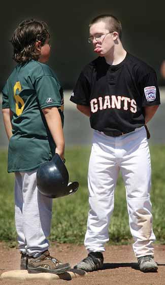 Right, Jenn Hinton helps her 16-year-old daughter, Jane, run the bases at a recent Challenger Giants game. Bottom, Eric Knight (left) enjoys a moment with Palo Alto Giant Alex Hays.