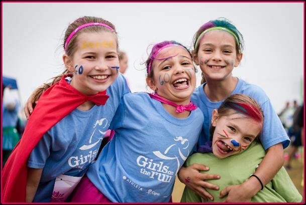 With their faces painted, silly socks and tutus and their community cheering them on, crossing the finish line is a defining moment when the girls