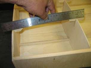 Use your plane to shave the top stringers (and sides) to the contour of the bulkheads.