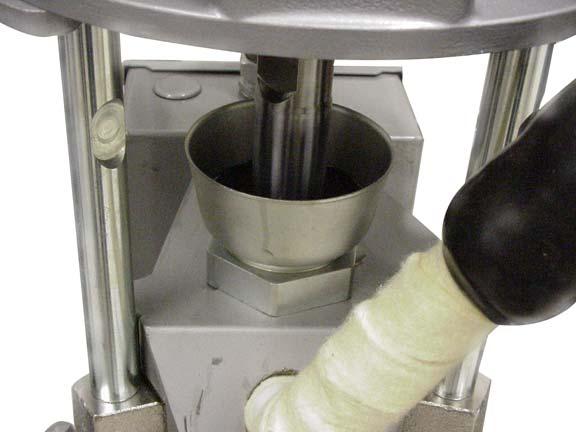 Mechanical Setup 4. Fill wet cup (Fig. 4), located on top of the displacement pump, 2/3 full of Graco TSL. fluid. 6.