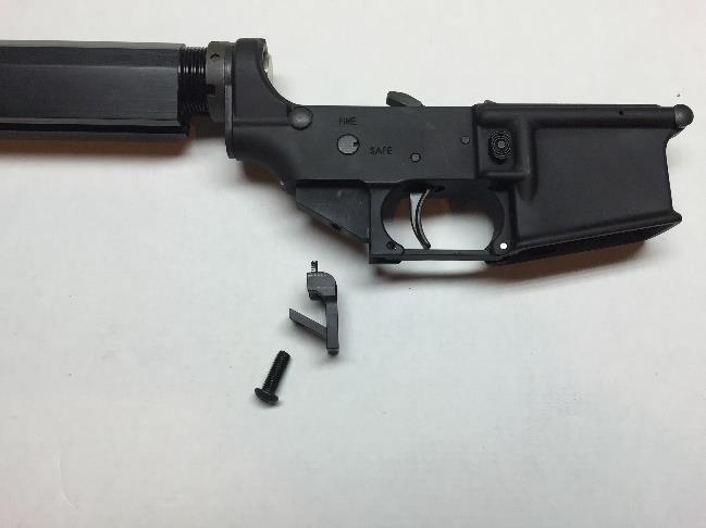 4. Install the DefendAR-15 trigger guard and use the small spring, referenced as (G) in the Parts Kit under Part Components, to replace the safety detent spring.