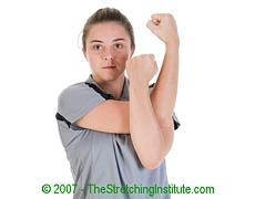 Bent Arm Shoulder Stretch: Stand upright and place one arm across your
