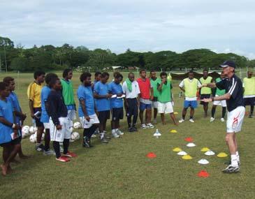 OFC Solomon Islands savour return of former coach Girls from the Solomon Islands share a team photo after training The FA s Alan Gillett received a hero s welcome when he