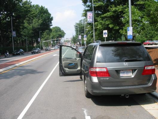 cars, creating a dooring hazard. Knowledgeable cyclists will often choose to ride outside a marked bike lane in such situations.