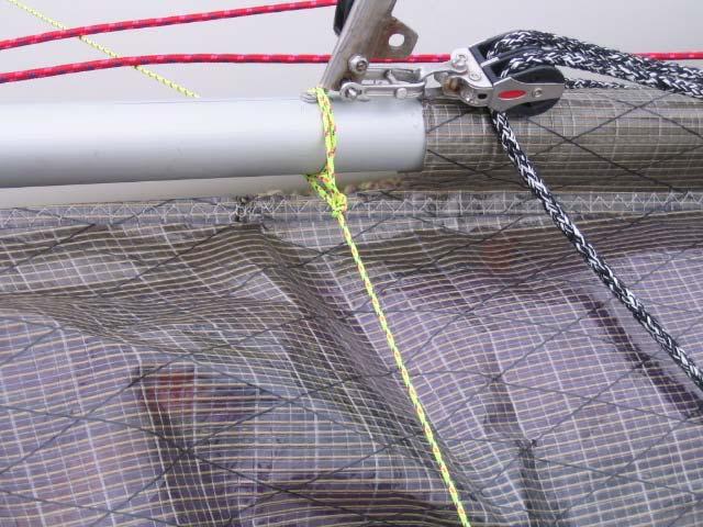 Then slide the saddle, mounted just aft of the spin hoop on the spin pole, into the bottom of the pelican striker tube assembly. This will then be pinned in place with the 2 stage halyard shackle.