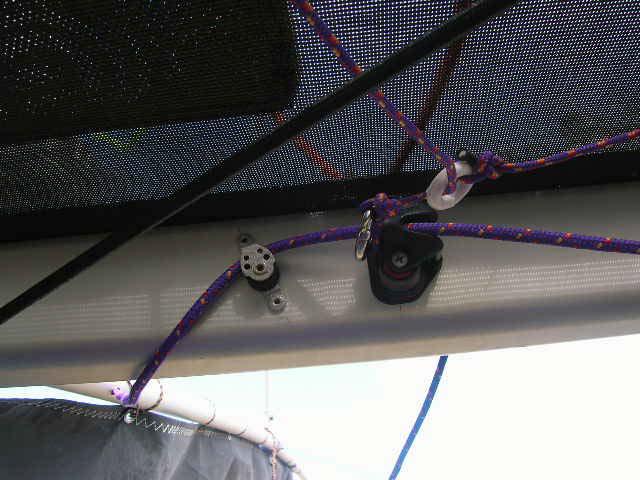 20.3 Tack release Locate the assembly labeled Tack Release. Feed the end with the loop through the grommet in the center of the tramp second aft of the trampoline pocket.