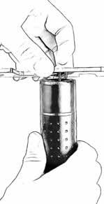 Holding the suppressor with a firm grip, rotate the tool counter-clockwise until the front cap is removed.
