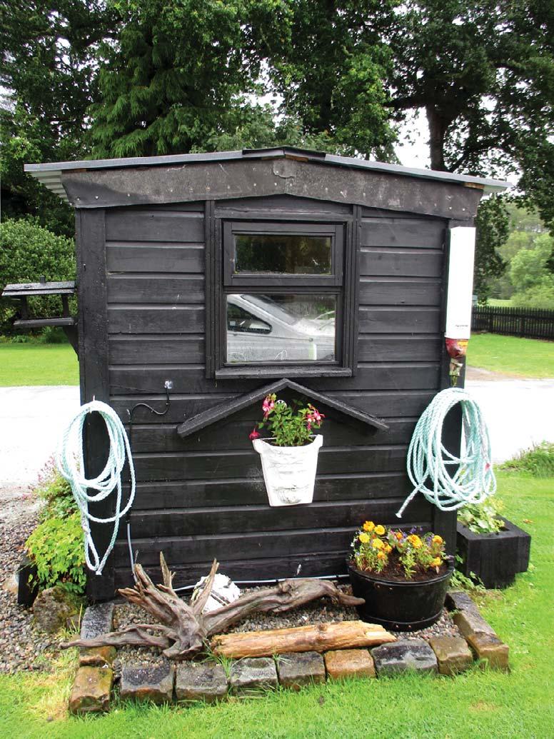 A lock-keeper s shed looking pretty, though the keeper of one lock told us that the damp weather made mowing the lock sides rather like painting the Forth Bridge no sooner finished than it all had to