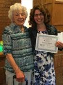 Judy Freund, Chair of the Christian Community Campus Foundation, awards Jennifer Varga with a $500 scholarship.
