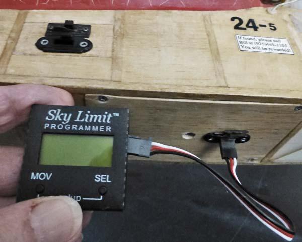 Sky Limit unit new charge plug Interior view of the Sky Limit unit attached with hook and loop and the new charge plug Master switch Rx Charge plug View of Sky Limit programmer plugged in Below: This
