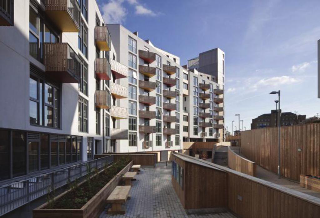 (c) 6 One Brighton has been designed to be a sustainable housing community. Study the photograph and its features below.