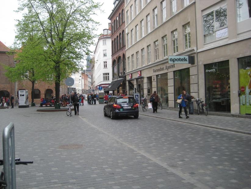 Shared space treatment in almost traffic-free road.