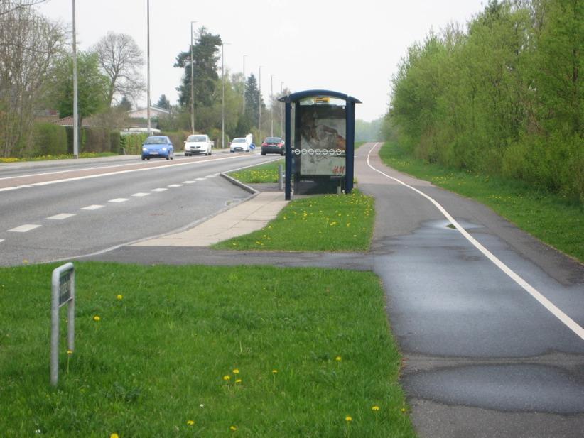 Bus stop on main suburban distributor.