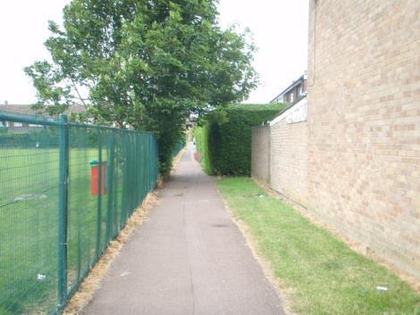 4m) and bounded by housing and fencing for the playing field (Photograph 2.5).