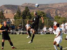 Goalkeeper Allan Orriny jumps to grab the ball during SCC's 1-1 tie against visiting Long Beach City.