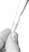To fit a tip-ejector extension: Hold the pipette with the push-button upright. Hold the extension with the slot upright. Slide the extension over the tip-holder.