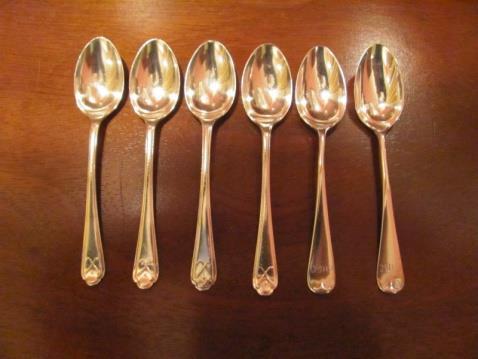 58. (3) Unmatched silver teaspoons with golf motif, (1) with an early 1900 s golfer putting, (1) with blue enameled R & C.